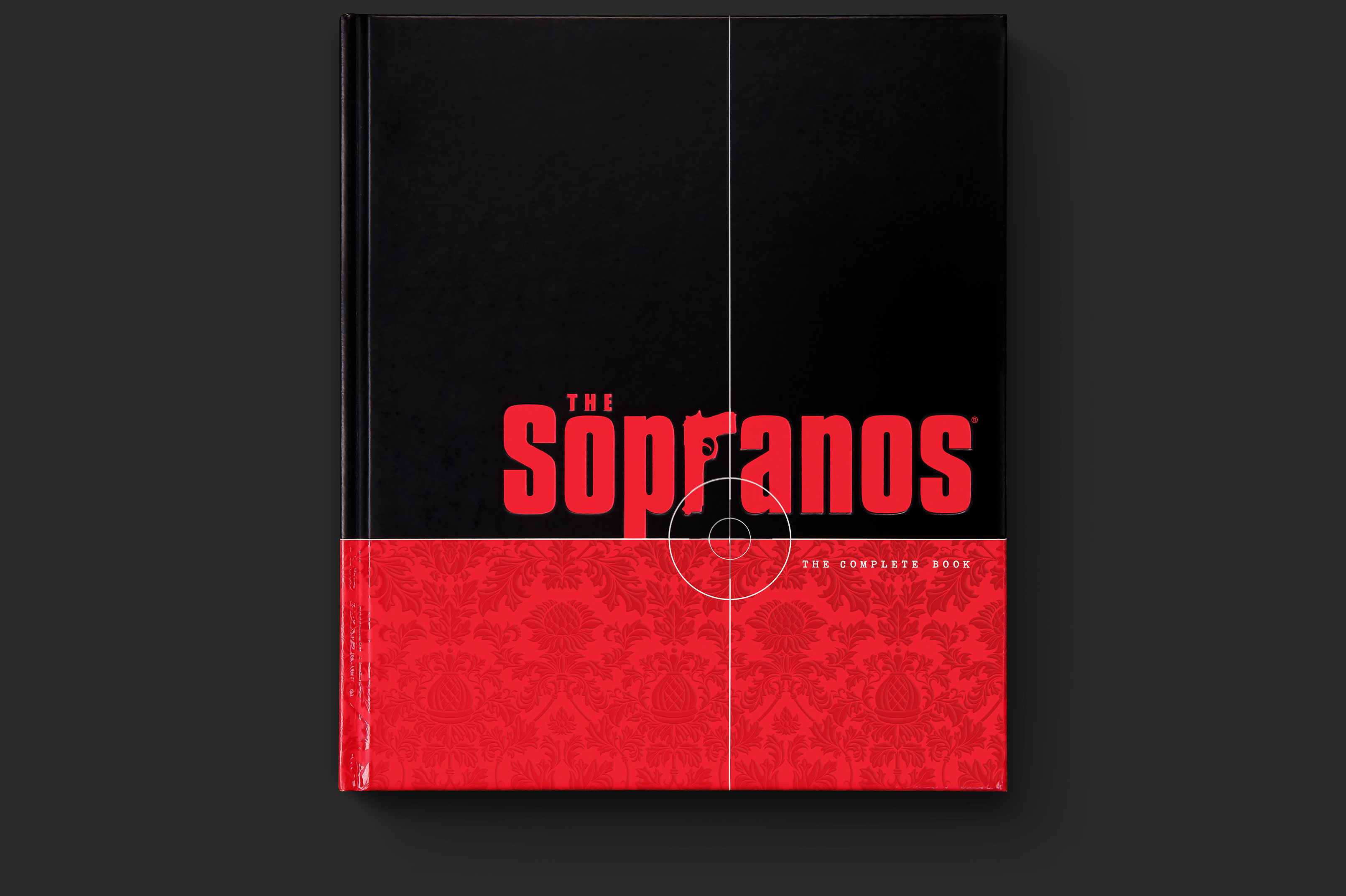Book cover with The Sopranos logo on black background, positioned above the lower third red botanical pattern, split by crosshair symbol.