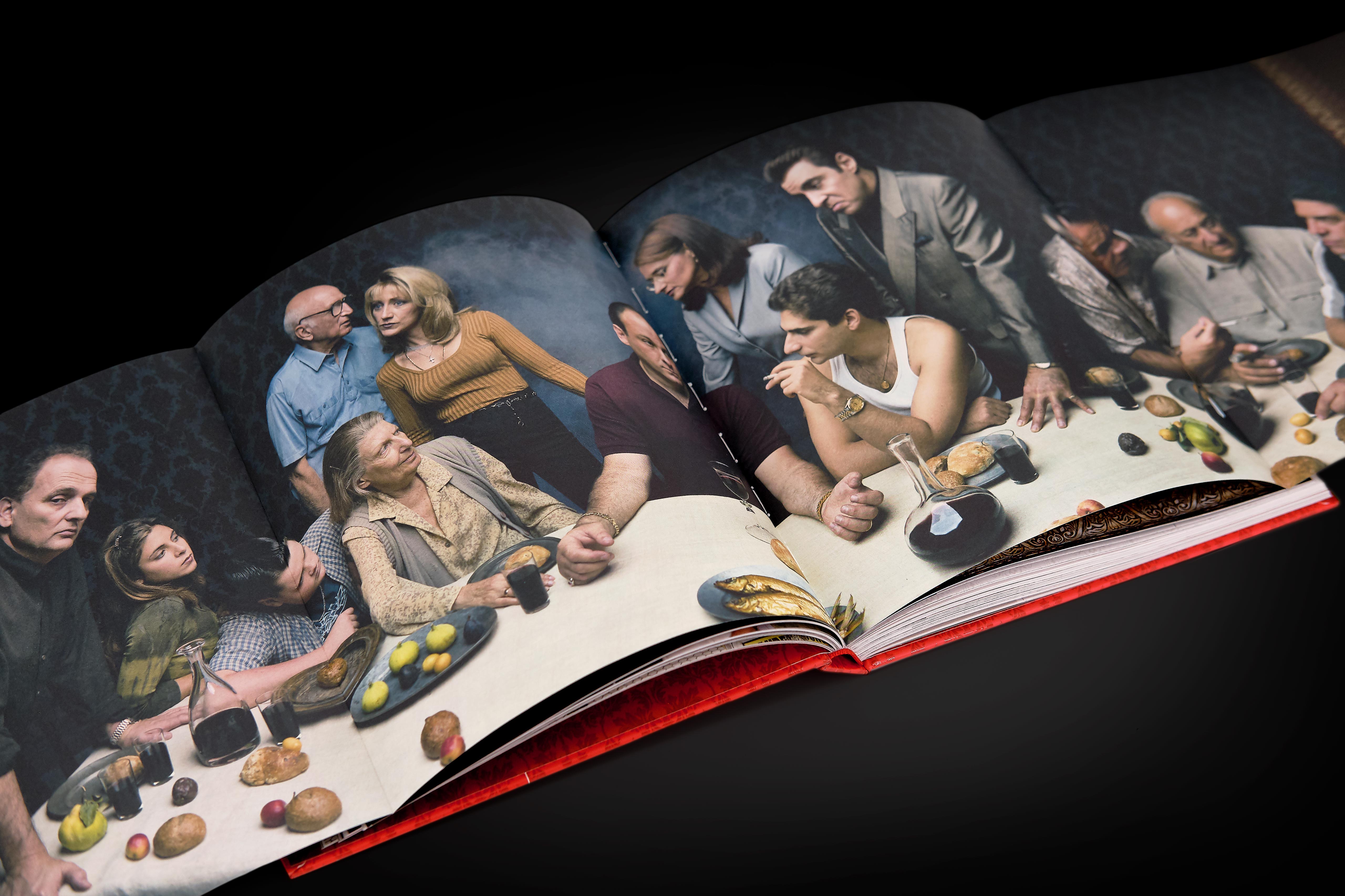 Angled shot of the gatefold unfolded to reveal Annie Leibovitz’s famous Vanity Fair portrait of the cast underneath quote spread.